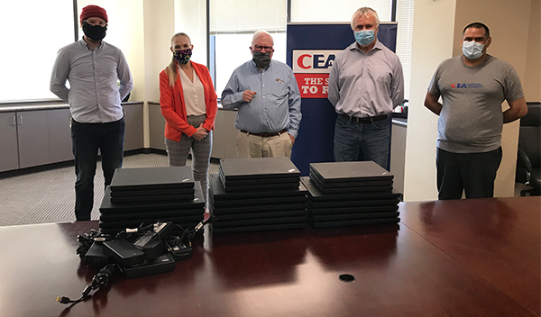 Image: The California Earthquake Authority (CEA) team donating laptops to members