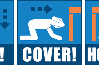 Image: Drop, Cover and Hold On during an earthquake