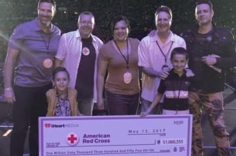 Image: A check presentation to the American Red Cross